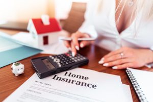 One of our agents helping a client learn how to file an insurance claim with their homeowners insurance